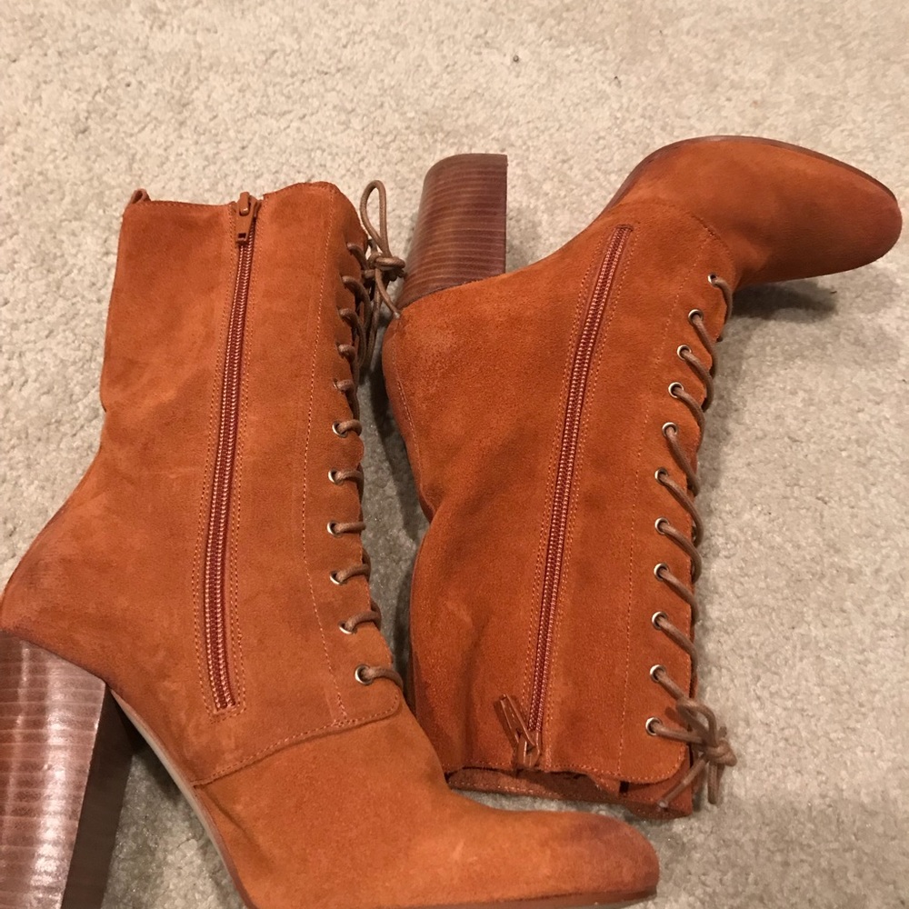 Suede brown and laced over the ankle boots.
